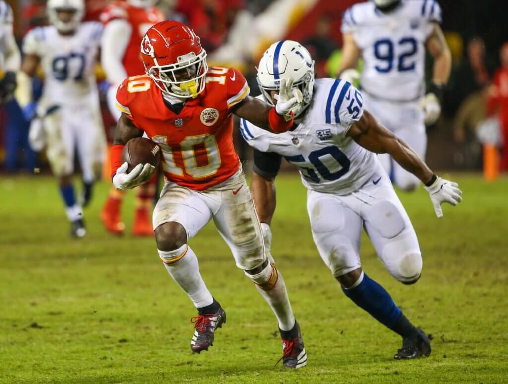 Tyreek Hill runs with the ball after the catch.