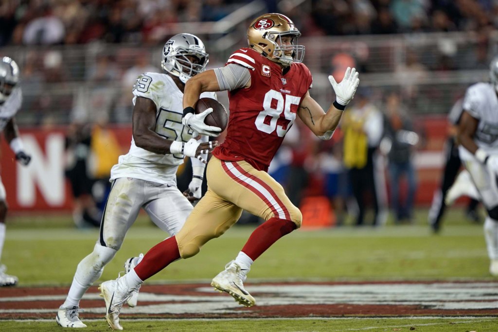 George Kittle picks up yards after the catch against the Raiders.