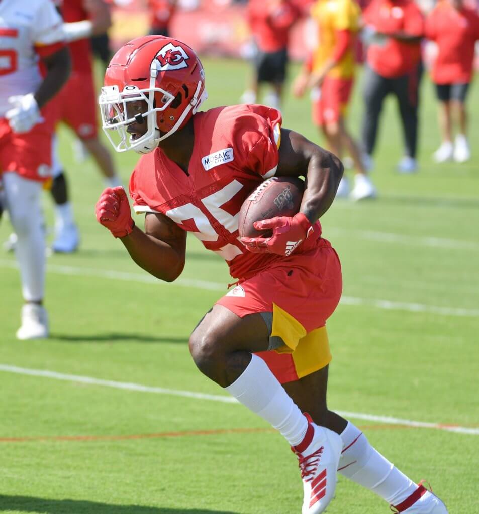 Darwin Thompson carries the ball during training camp.