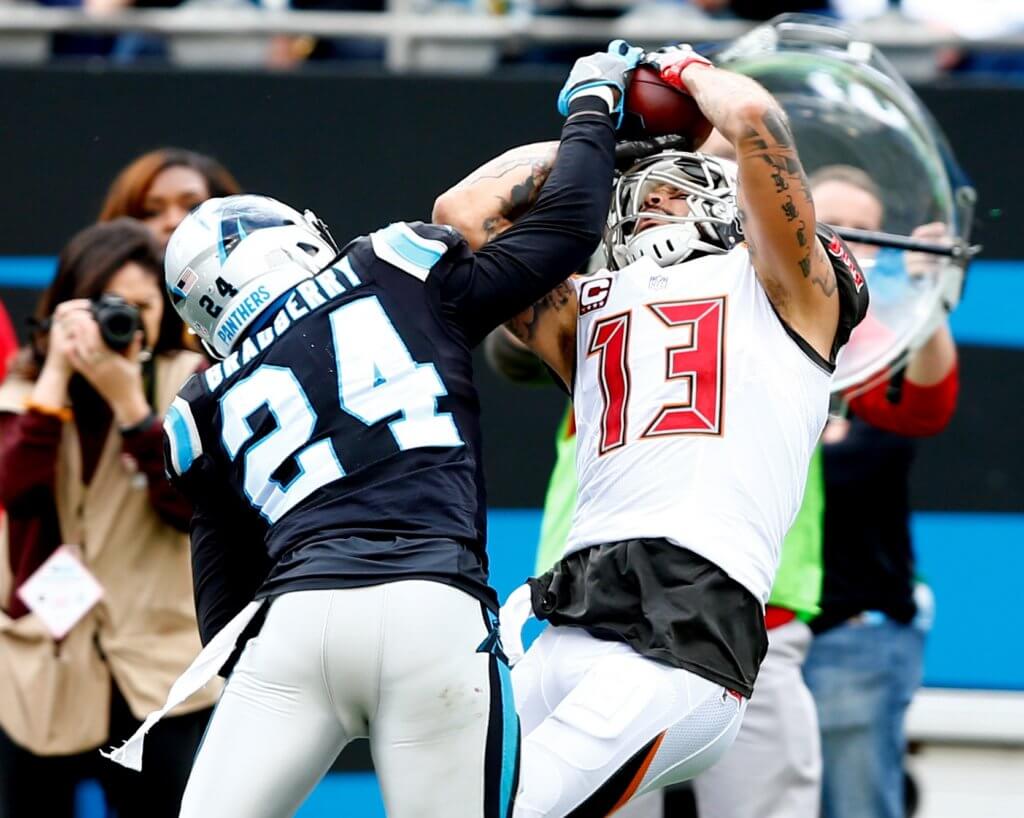 Mike Evans and James Bradberry contend for a catch.