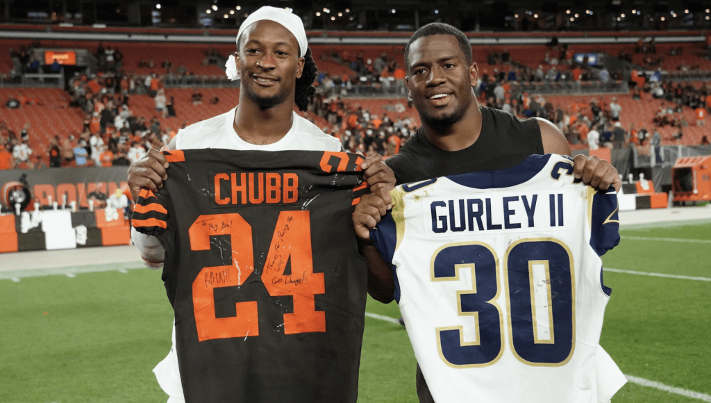 Chubb and Gurley, holding each other's jerseys for picture
