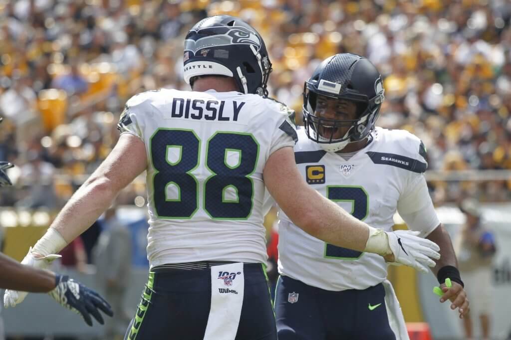 Will Dissly and Russell Wilson celebrate after scoring a touchdown.