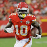 Tyreek Hill runs with the ball.