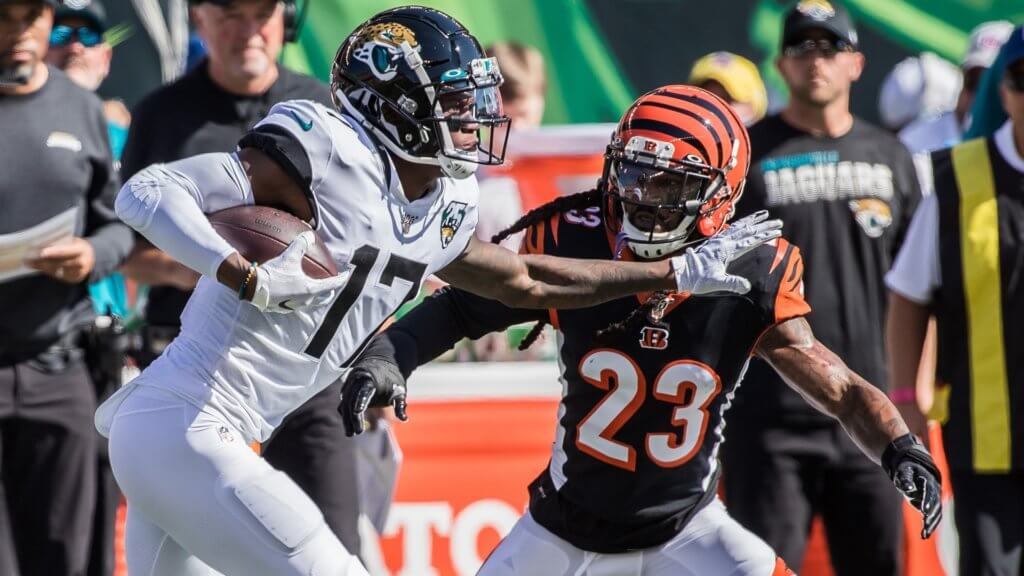 Jacksonville Jaguars wide receiver D.J. Chark (17) runs with the ball while Cincinnati Bengals cornerback B.W. Webb (23) defends in the first quarter at Paul Brown Stadium