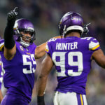 Danielle Hunter celebrates with Anthony Barr after a play.
