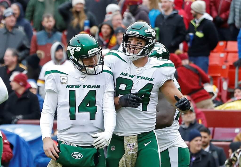Sam Darnold and Ryan Griffin celebrate after a touchdown.