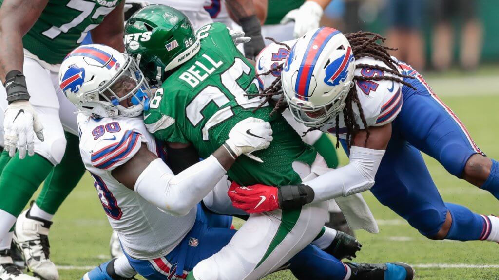 Week 10 IDP Report: Jets running back Le'Veon Bell (26) is tackled by Buffalo Bills defensive end Shaq Lawson (90) and middle linebacker Tremaine Edmunds (49)