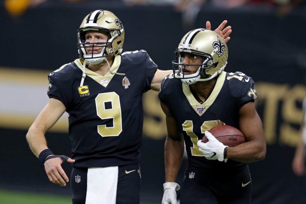 Drew Brees celebrates with Michael Thomas after completing a fourth quarter touchdown reception.