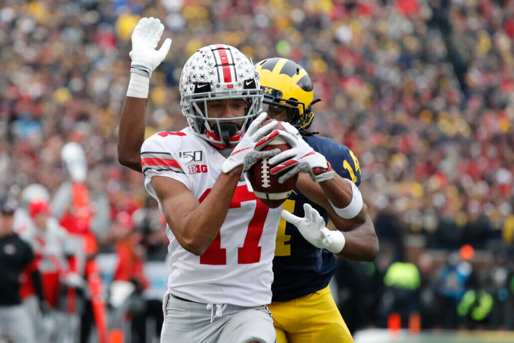 Nov 30, 2019; Ann Arbor, MI, USA; Ohio State Buckeyes wide receiver Chris Olave (17) makes a reception for a touchdown defended by Michigan Wolverines defensive back Josh Metellus (14) in the first half at Michigan Stadium. Mandatory Credit: Rick Osentoski-USA TODAY Sports
