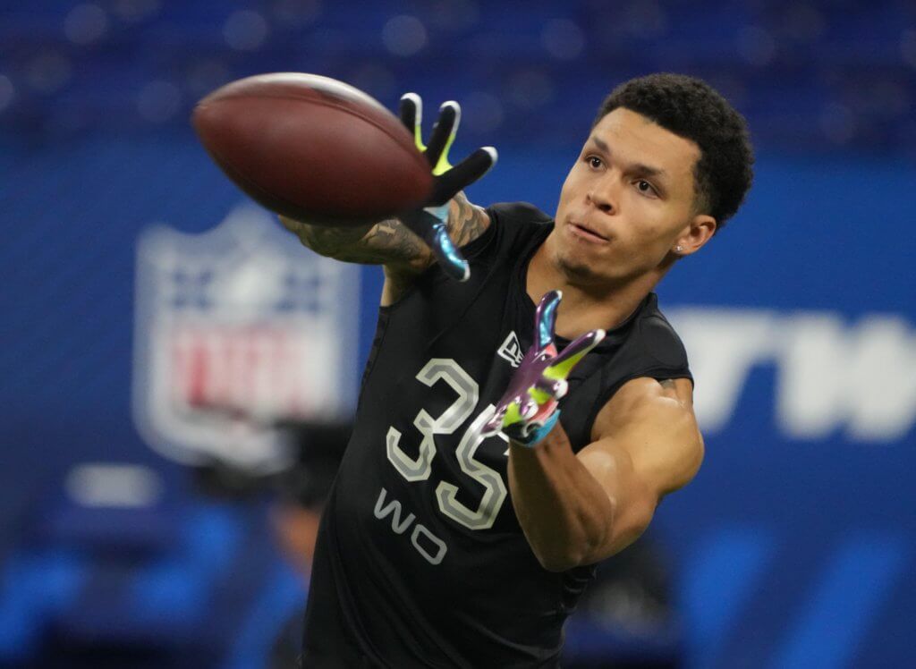 Christian Watson goes through drills during 2022 NFL Combine