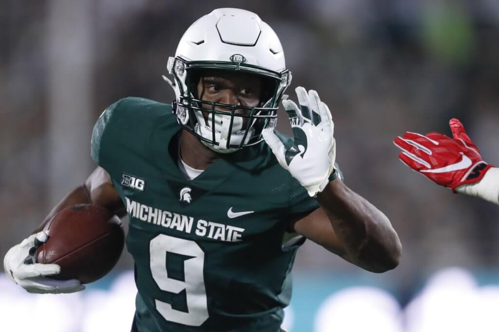 Kenneth Walker runs for a touchdown at Michigan State.